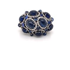 146 Round Diamonds 0.99CT 8 Oval Sapphires 6.29CT 14 Round Sapphires 1.51CT 18K White Gold 15.25GM Round Multi-stone Sapphire Ring, Sapphire Cluster Ring, Round Sapphire, Multi Stone Ring, Multi Stone, Cluster Ring, Stone Rings, Round Diamonds, Diamond Jewelry