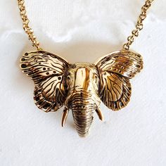 "Gold Elephant With Butterfly Wings Pendant Necklace Handmade Measures 3\" W X 2\" H Hand Cast With Every Detail In Mind" Elephant With Butterfly, Wings Pendant, Gold Elephant, Animal Pendant, Brass Charms, Hand Cast, Butterfly Wings, Necklace Handmade, Handmade Necklaces