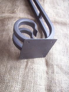 a metal object sitting on top of a piece of cloth