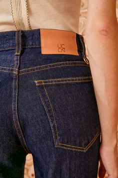 The Agnes Jean is a forever favorite reimagined with a cropped, straight-leg in our deep indigo Tigris wash. Handmade in Los Angeles from premium non-stretch denim, this classic style features a high rise, clean lines, and is traced with contrast stitching. It is finished with a logo-embossed leather patch and hand-hammered ring at the back belt loop. Composition: 100% Cotton Pair with our Halia Earring to complete the look. Nyc Boutiques, Deep Indigo, Hammered Ring, Signature Print, Knit Sweatshirt, Handbag Shoes, Cropped Denim, Leather Patches, Ulla Johnson