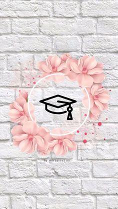 a white brick wall with pink flowers and a graduation cap on it's side