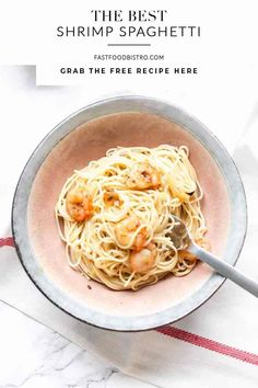 the best shrimp spaghetti recipe in a bowl with a spoon and napkin next to it