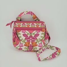 VERA BRADLEY ID CROSSBODY WALLET PURSE - "LILLI BELL" RETIRED PATTERN This adorable, crossbody purse with ID & credit card slips is perfect for on the go! Lots of sections & pockets that close securely with zippers or snaps.   MEASURES approx. 8"w x 7"h x 2"d OUTSIDE - Quilted Vera Bradley purse in a retired pattern called "Lilli Bell". It features a floral pattern in pink, purple, green, orange & yellow on a white background . Front has a zippered pouch. Long adjustable strap to be worn over th Pink Adjustable Bag, Pink Adjustable Shoulder Bag For Daily Use, Crossbody Wallet Purse, Vera Bradley Purses, Id Wallet, Zippered Pouch, Crossbody Wallet, Vintage Jewels, Zipper Pulls