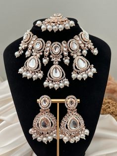 rose gold polish pearl uncut kundan choker set with tikka x earrings.  lightweight earrings  Style tip- ----------- Pair it with any beautiful traditional outfits  and flaunt with Unique style of collection from us. Perfect match for Festival and Traditional wear.  Take Care Tips-  ---------------- Kee away from perfume, Hair spray and. Moisture.  Store in dry place , Ziplock bag or Airtight box.    Clean with dry cloth.  Jewellery is the last thing you should wear and first thing you should rem Rose Gold Chandbali Jewelry For Wedding, Traditional Rose Gold Jewelry Sets For Wedding, Rose Gold Choker For Wedding, Rose Gold Wedding Choker Jewelry, Rose Gold Chandbali Wedding Jewelry, Festive Rose Gold Chandbali Jewelry, Traditional Rose Gold Party Necklace, Traditional Rose Gold Necklace For Party, Festive Rose Gold Bridal Necklace For Wedding