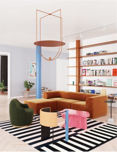 a living room filled with furniture and bookshelves