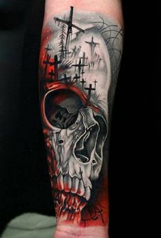 a man's arm with a skull and cross tattoo on it