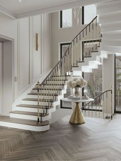 an elegant staircase with white flowers and gold accents in a modern style living room setting