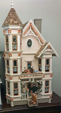 a doll house is shown on a table