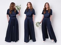 "Navy blue silk jumpsuit is the elegant jumpsuit suitable for every occasion inspiring a feminine silhouette. Whether you're petite, curvy, straight or tall a dress flatters every figure and every size designed for a slim but relaxed fit. This jumpsuit is made of charming delicate fabric which offers an eye-catching sheen and a second-skin feeling texture. You can find the pictures of ALL OTHER MATCHING SILK DRESSES & JUMPSUITS in our catalog on ETSY here: https://www.etsy.com/shop/ENMEstyle?ref Spring Evening Satin Jumpsuits And Rompers, Elegant Silk Jumpsuits And Rompers For Party, Elegant Silk Jumpsuit For Party, Elegant Wide Leg Maxi Dress For Evening, Elegant Wide Leg Evening Maxi Dress, Spring Formal Silk Jumpsuits And Rompers, Elegant Satin Jumpsuits And Rompers For Summer, Chic Bridesmaid Jumpsuits And Rompers, Elegant Summer Jumpsuits And Rompers For Wedding Guests