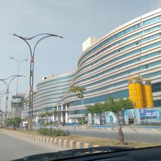 an empty street in front of a large building