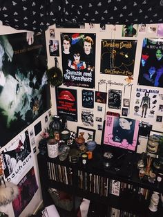 a room filled with posters and pictures on the wall