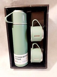 thermos vacuum bottle in its box is open and ready to be used by someone