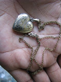 "A lovely antique Victorian gold filled etched sweetheart locket and chain. The locket measures 1 1/4'' with the chain loop x 3/4'' x 5.5mm thick. The chain measures 18 1/2''. Stamped \"1/20 12kt GF\" on the clasp. In beautiful condition with some signs of age. The locket hinge opens and closes smoothly,and closes with a crisp snap." Locket Gold, Gold Heart Locket, Chain Loop, Love Token, Victorian Gold, Heart Locket, Gold Heart, Heart Of Gold, Antique Victorian