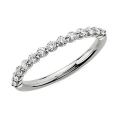 a white gold wedding band with round diamonds