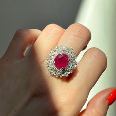 18KT White Gold Oval Ruby + Pave Diamond ring Size 8 Can be resized for an additional fee Large Statement Ring Lovely intricate design This an absolutely lovely attention getting piece! Round and Baguette Diamonds with Oval Faceted Ruby Ring. Approx 4.83 CT Ruby 10.7 x 9.9x 5.7 mm 2.20 CT Diamond Approx 9.8 grams 18KT Stamped Abrasions to the Ruby, which could be polished out by a stone cutter. We can quote for that if need b3, but this ring is so pretty, it really does not need. Check out all o Luxury Oval Ruby Diamond Ring, Luxury Oval Ruby Ring With Halo Design, Luxury Marquise Ruby Ring, Dazzling Oval Ruby Ring With Diamonds, Luxury Oval Ruby Ring, Exquisite Oval Ruby Ring In White Gold, Luxury Ruby Ring With Oval Center Stone, Exquisite Oval Ruby Ring Gia Certified, Luxury Oval Ruby Ring With Center Stone