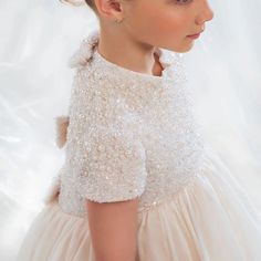 This elegant ivory dress is the perfect choice for your little one's special occasions. With delicate bead and pearl details and a princess-style cut, this Dubai-inspired dress will make your child feel like royalty. Ideal for weddings, birthdays, and first communions, it exudes elegance and grace. Don't miss out on the Dreamy Vow 2024 J053 dress for an unforgettable celebration. Cream Princess Dress For First Communion, Cream Tulle First Communion Dress For Pageant, Cream Tulle First Communion Dress, White Princess Dress With Pearl Embroidery, Elegant Princess Dress With Pearl Embroidery And Tulle, Elegant Tulle Princess Dress With Pearl Embroidery, Cream Princess Dress For Pageant, White Embellished Princess Dress, Princess Dresses With Pearl Embroidery For Pageant