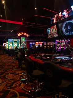 a casino room filled with lots of slot machines