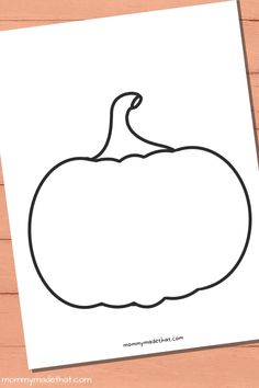 the outline of a pumpkin is shown on top of a piece of paper, next to a