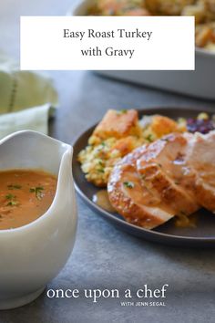 a bowl of soup next to a plate of food