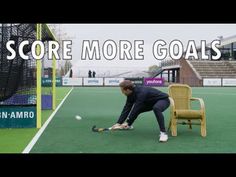 a man kneeling down in front of a chair on top of a green field with the words score more goals