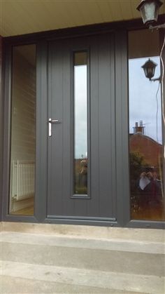 the front door to a house with two sidelights