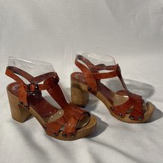 New Brown Leather Studded Platform Sandals. Adjustable Strap. Made In Spain. Never Worn Orange Closed Toe Clogs For Summer, Brown Clogs With Heel Loop For Spring, Orange Round Toe Clogs For Summer, Casual Brown Mules With Heel Strap, Orange Sandals With Stacked Heel And Round Toe, Orange Round Toe Sandals With Stacked Heel, Casual Brown Sandals With Block Heel, Casual Brown Heels With Wooden Heel, Casual Brown Block Heel Sandals