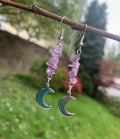 You will receive a custom pair of silver earrings with genuine light purple amethyst crystal chips and dangling half-moon charms. ✨ The earrings in the pictures are examples and approximately 5,7cm in size. I can also make them with other gemstones which you can select in the drop down menu.  Also available in gold! These are made per request and might vary a little from the examples pictured. Each of my creations is handmade and unique. 💖 Please don't hesitate to contact me if you have any questions! Adjustable Purple Moon Phase Jewelry, Amethyst Moon Charm For Jewelry Making, Dangle Crystal Earrings With Moon Charm For Gifts, Amethyst Dangle Crystal Earrings With Natural Stones, Amethyst Natural Stone Dangle Crystal Earrings, Purple Moon Shaped Spiritual Jewelry, Handmade Purple Crescent Jewelry, Spiritual Purple Moon Shaped Jewelry, Spiritual Purple Moon-shaped Jewelry