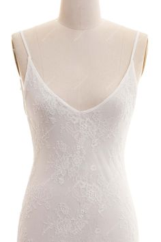 This illusion slinky stretch boho lace beach slip bridal gown is elevated by figure-flattering seaming and glamorous, simply adjustable spaghetti straps that lead from deep V-neckline to a flirting open black. It just simply works well on its own with bridal lingerie, or as a lining for an illusion wedding dress. shown color white bra support no boning no closure no lining without lining Fitted V-neck Slip Dress With Delicate Lace, Fitted V-neck Slip Dress With Lace Bodice, White Lace Slip Dress With Spaghetti Straps, Fitted V-neck Slip Dress With Lace Back, Backless Lace Slip Dress With Lace Back, Wedding V-neck Camisole With Delicate Straps, Lace Slip Dress With Spaghetti Straps For Wedding, Backless Lace Slip Dress For Wedding, Fitted Lace Trim Backless Camisole