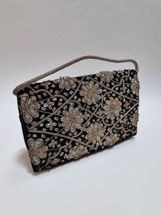 "A beautiful 1950's Zardozi velvet evening bag. Excellent vintage condition. Clean and ready to use. 8\" x 5\" x 2\". Strap: 10.5\". Take a look at our other Zardozi bags for sale :) -------------------- 🌟P&P: 👉Will arrive gift wrapped, in a padded envelope. 👉UK shipping: Free 2nd Class Signed For 👉International Shipping: Tracked & Signed For -------------------- 💎 FOLLOW US:  👉 www.instagram.com/janedreamsofvintage 👉 www.facebook.com/JaneDreamsOfVintage" Embroidered Evening Clutch Pouch, Formal Embroidered Pouch Evening Bag, Embroidered Rectangular Evening Clutch, Embroidered Rectangular Clutch For Evening, Embroidered Evening Clutch Shoulder Bag, Embroidered Evening Clutch For Festivals, Evening Clutch With Gold Embroidery, Black Embroidered Pouch Evening Bag, Embroidered Black Evening Bag For Events