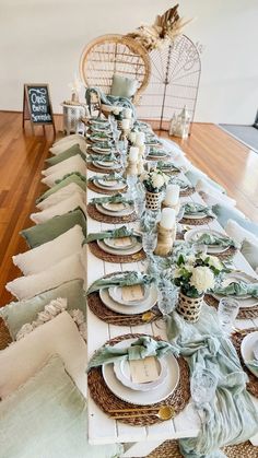 a long table set with plates and place settings