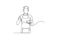 a man in an apron is holding a cup