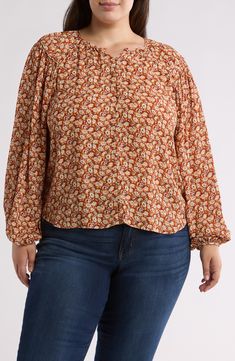 Ditsy blooms in vibrant hues draw the eye to this woven top that instantly elevates your day-off look. Front keyhole with button-and-loop closure Jewel neck Long sleeves 100% viscose Dry clean Imported Multicolor Floral Print Tops For Fall, Fall Floral Print Multicolor Tops, Floral Print Patterned Tops For Fall, Patterned Floral Print Tops For Fall, Bohemian Ditsy Floral Print Tops For Fall, Flowy Multicolor Tops For Fall, Orange Floral Print Relaxed Fit Blouse, Orange Relaxed Fit Blouse With Floral Print, Multicolor Print Tops For Fall, Relaxed Fit