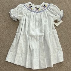 Nwt Ruth & Ralph Purple Polka Dot Witches Dress, Size 2t Cute White Smocked Dress With Short Sleeves, White Short Sleeve Smocked Dress For Playtime, White Smocked Dress For Playtime, Spring Fitted Smocked Dress For Playtime, White Smocked Bodice Dress For Playtime, Cute White Smocked Dress For Playtime, Casual Smocked Dress For Playtime, Casual Fitted Smocked Dress For Playtime, White Playtime Dress With Smocked Cuffs