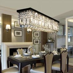 a chandelier hanging over a dining room table