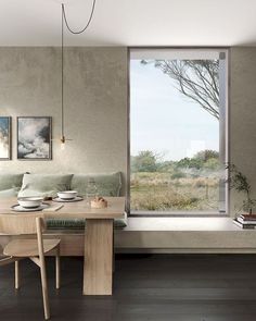 a living room filled with furniture next to a large window covered in windowsills