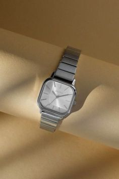 A modern approach to a distinctive and classic style. The Esther watch from BREDA carries a bold 26mm square case, sun-ray brushed dial, and fastens with a stainless steel bracelet. A style that transcends occasion or trend, created with timeless design in mind. Content + Care 316L Stainless Steel Clean your band with the use of a damp cloth and mild leather cleaner. Imported Size + Fit 26MM Case Diameter | BREDA Esther Watch in Light Grey at Urban Outfitters Metal Watch, Gift Guide For Him, Stainless Steel Cleaning, Square Watch, Stainless Steel Band, Watch Movement, Steel Bracelet, Michael Kors Watch, Silver Watch