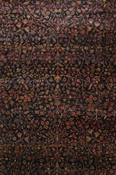 an area rug with various colors and designs