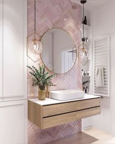 a bathroom with a sink, mirror and lights on the wall next to it's cabinets