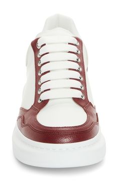 Bold colorblocking brings a retro look to this house-signature sneaker crafted of calfskin leather and grounded on a chunky sole with debossed leopard tread. Lace-up style Leather upper and lining/synthetic sole Made in Italy Designer Shoes White Calf Leather Sporty Sneakers, Sporty White Calf Leather Sneakers, White Platform Sneakers With Calf Leather And Rubber Sole, White Calf Leather High-top Sneakers, Sporty Style, White Calf Leather Platform Sneakers With Rubber Sole, White Sporty High-top Sneakers In Calf Leather, White Calf Leather High-top Sneakers, White Calf Leather High-top Sneakers With Contrast Sole, White Low-top Calf Leather Platform Sneakers