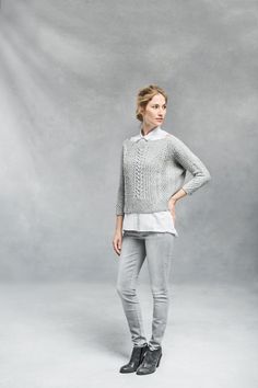 Architectural and completely modern in shape, this cropped pullover is a compelling knit and an eye-catching addition to any wardrobe. The front, back, and sleeves are simple quadrangles worked flat and seamed to achieve a wide, swingy shape with an open neckline and snugly fitted three-quarter-length sleeves. The interplay of twisted ribs, cables, and traveling stitches yields a fabric that wants to move and fold, and clever placement of each element creates flattering lines on the body. Ondawa Chic Textured Knit Long Sleeve Crop Top, Chic Long Sleeve Textured Knit Crop Top, Modern Fitted Sweater For Layering, Stretch Cropped Sweater With Fine Knit Long Sleeve, Stretch Cropped Sweater With Long Sleeves In Fine Knit, Stretch Long Sleeve Cropped Sweater In Fine Knit, Fitted Cable Knit Cropped Sweater For Layering, Fitted Knit Cropped Sweater For Layering, Fitted Cropped Sweater For Work