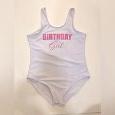 Girls “Birthday Girl” One Piece Swimsuit; Little Girls Size Xs/Size 6. White One Piece With Light Pink Writing. Ordered For My Daughter’s Birthday, She Wore It Once For An Hour Or Two So It’s In Excellent, Gently Worn Condition (Basically Brand New). Ordered From A Boutique Online! #Girlswimwear #Girlsbirthday #Littlegirlsbirthday #Childrensswim #Kidswim #Girlsswim #Girlsbirthday #Birthdayonepiece #Kidsswimwear #Kidsswim #Kidsonepiece #Kidsswimonepiece Cute Fitted Bodysuit For Birthday, Fitted Bodysuit For First Birthday In Summer, Birthday Fitted Letter Print Bodysuit, White Fitted Bodysuit For Birthday, Fitted White Bodysuit For Birthday, White Fitted Fun Bodysuit, Fun Fitted White Bodysuit, Fitted White Swimwear With Letter Print, White Fitted Swimwear With Letter Print