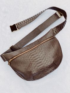 The Large Crossbody Pouch can be worn across the body in front for extra security, or slung around the back as a body hugging backpack. It can also be worn as a traditional handbag over the shoulder. There is a 7" interior zipper, and the entire bag can be securely closed with an exterior zipper. The strap is adjustable from 46" to 58" long. Since 1970, the sale of any python skin has been banned in the state of California due to inhumane slaughtering practices. Now you can enjoy the beautiful l Python Skin, California State, Python, Midnight Blue, Pouch, Backpacks, California, Exterior, Zipper