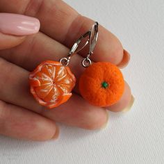 Realistic miniature tangerine earrings.The size of a tangerine is about 1,8 cm (0.7 in)Length of earrings is about 3,5 cm (1.2 in)Material: polymer clay♥ Tangerine Necklace https://www.etsy.com/listing/603445164/miniature-mandarin-pendant-realistic♥ Tangerine Ring https://www.etsy.com/listing/684695535/tangerine-ring-birthday-gift-under-15Other earrings you can see here: https://www.etsy.com/shop/RinaStudioDesign?section_id=24005662• Submersion in water is not recommended for polymer clay as thi Orange Round Jewelry As A Gift, Orange Drop Earrings For A Gift, Unique Orange Jewelry For Gift, Unique Orange Jewelry For Gifts, Round Orange Jewelry For Gifts, Nickel Free Orange Earrings For Gift, Orange Round Jewelry For Gifts, Orange Earring Jewelry Gift, Orange Earrings With Ear Wire For Gift