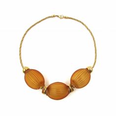 Lalique “Nerita” 18 kt Yellow Gold over Sterling & Amber Crystal Necklace. Available at sklimited.com Elegant Luxury Amber Crystal Necklaces, Luxury Amber Citrine Necklace, Tiny Shells, Lalique Jewelry, Amber Crystal, Rene Lalique, The Pacific Ocean, Gold Plated Chains, Pacific Ocean