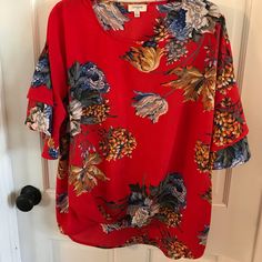 This Beautiful Red Floral Umgee Top Has Ruffled Bell Sleeves And A Slight Tie At The Bottom Hem. New Without Tags. Size L. Vibrant Red Short Sleeve Top, Vibrant Red Summer Tops, Vibrant Red V-neck Top, Red Flowy Short Sleeve Blouse, Flowy Red Short Sleeve Tops, Vibrant Red Floral Print Blouse, Flowy Red Floral Print Top, Ruffle Bell Sleeve, Umgee Tops