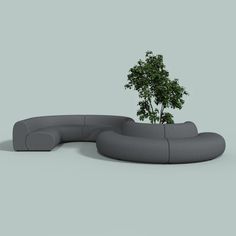 a couch with a tree in the middle of it on a gray background, there is no image here to provide a caption for