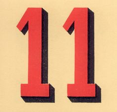 the number 11 is red and black in color