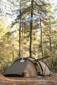 a tent is pitched up in the woods