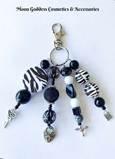 a keychain with several charms attached to it on a white background that says, no godless connections & accessories