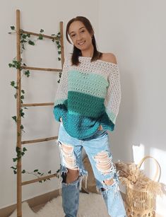 ✤ It's a sweater in shades of aqua green and white, with stripes on the front and sleeves, and plain white on the back. It's crocheted with a very soft and hypoallergenic acrylic wool. ✤ It's a very comfortable, loose-fitting sweater with a boat neck that you can let drape over your shoulders, making it even more comfortable. Pair it with leggings for a cozy at-home outfit, or with jeans for heading out to work or for a stroll. ✤ The dropped shoulder sweater is one size fits all, and its measure Green Crochet Knit Sweater, Green Long Sleeve Crochet Sweater, Green Crochet Casual Sweater, Green Crochet Sweater Casual Style, Green Casual Crochet Sweater, Green Crochet Top For Winter, Green Crochet Winter Top, Casual Green Crochet Sweater, Blue Crochet Sweater